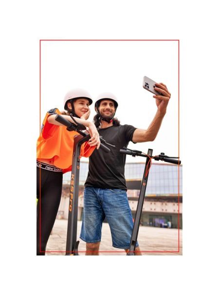 a couple taking a selfie while riding a yadea ks5 pro kickscooter